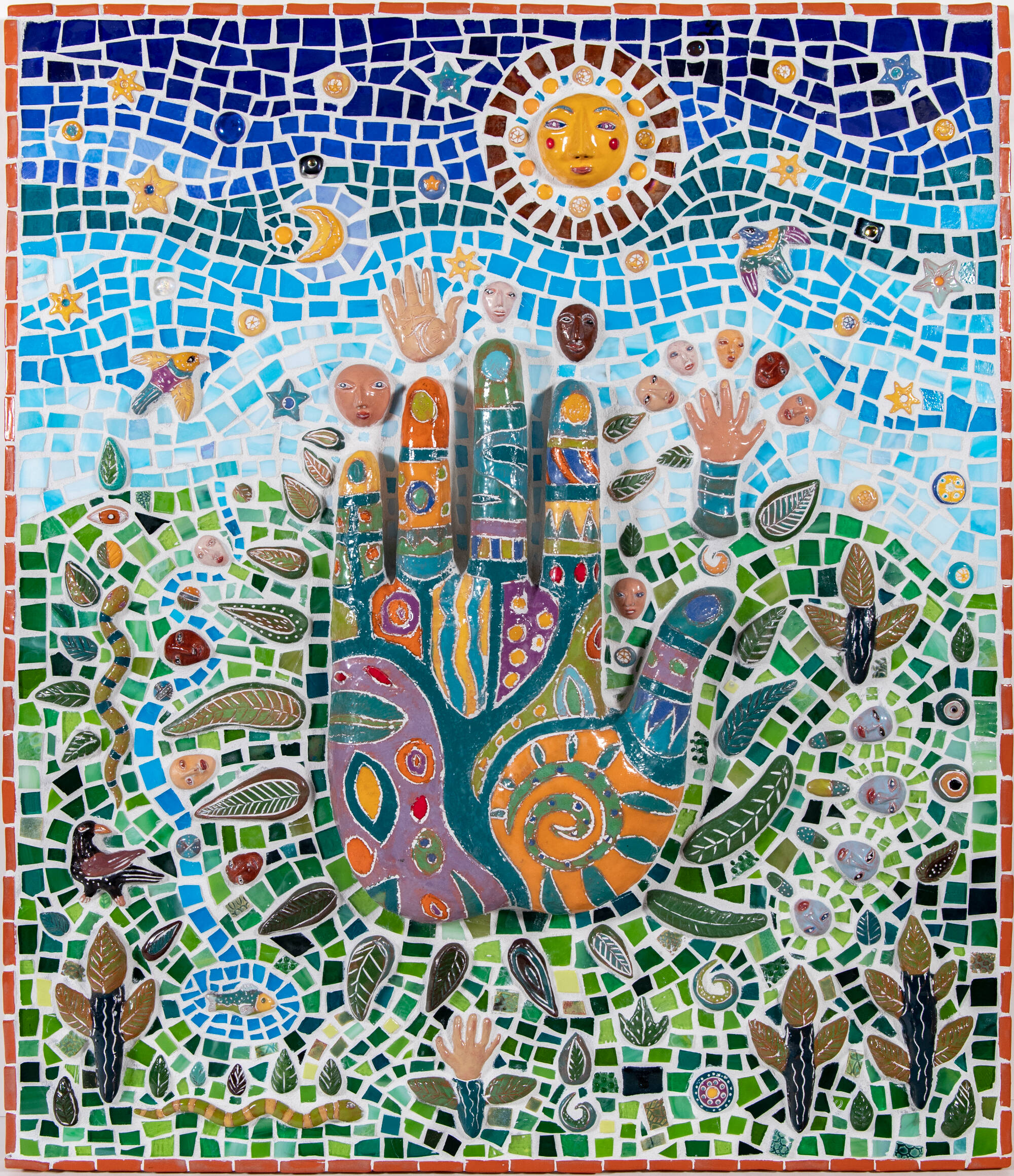 Ceramic tile piece depicting a multicolored hand and sun and many other entitys.